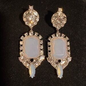 Statement earring for silver lovers. Post back rhinestone and opal glass stone